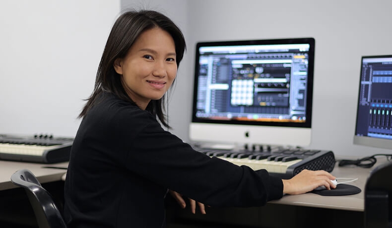 Sound design student looking at camera