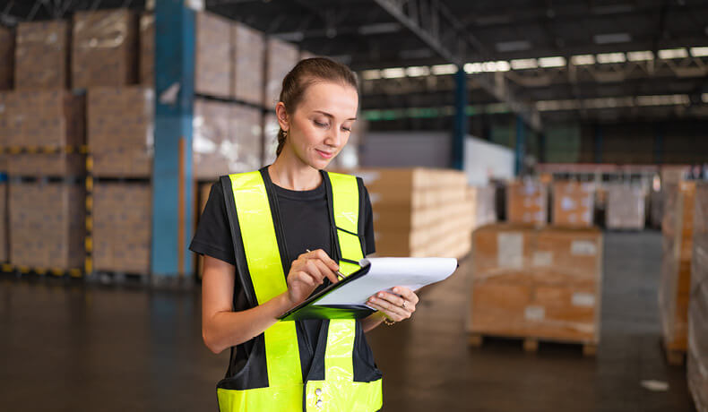 A women working in a warehouse setting